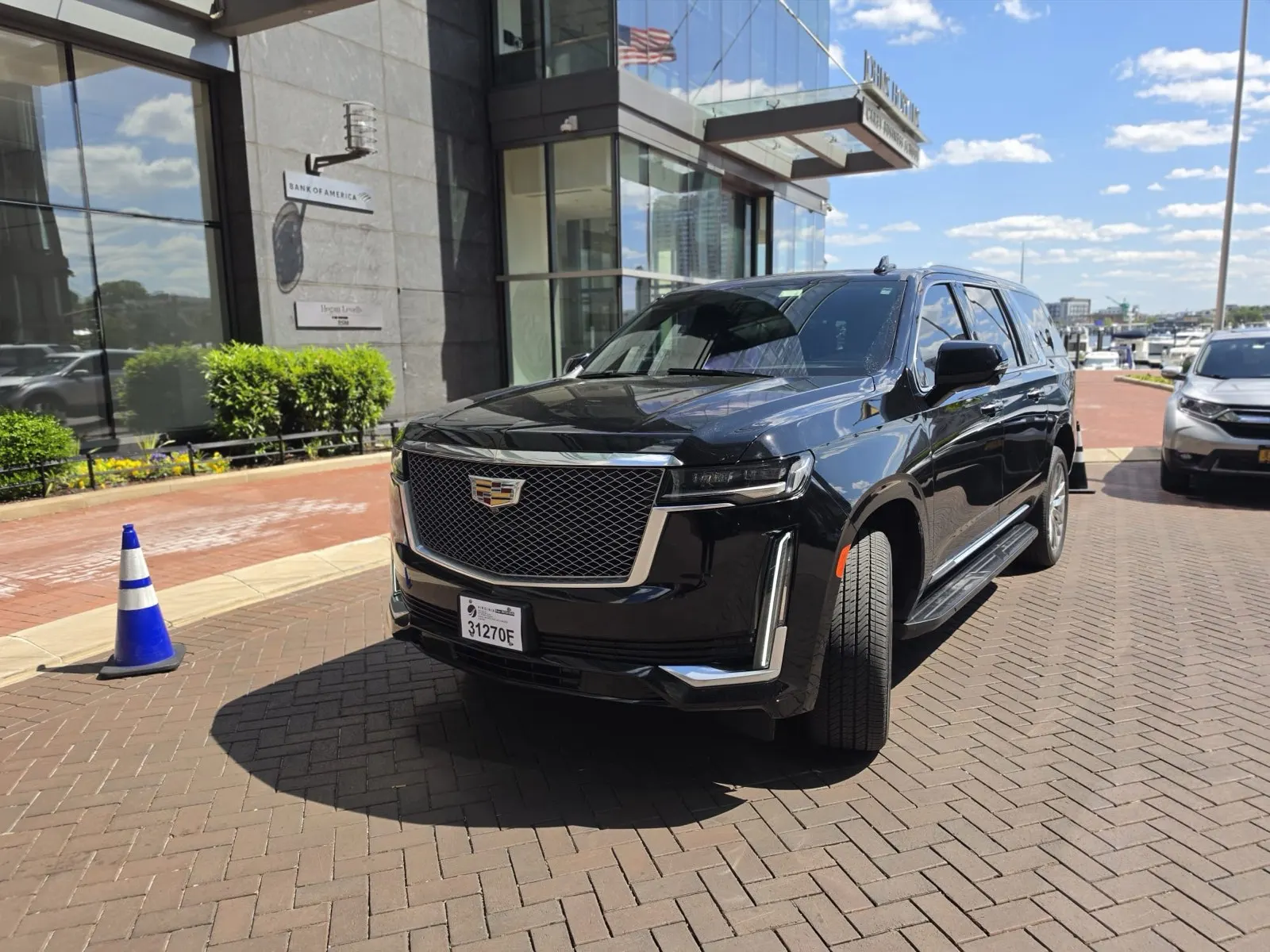 Black Cadillac Escalade ESV parked at Harbor East on the Baltimore waterfront